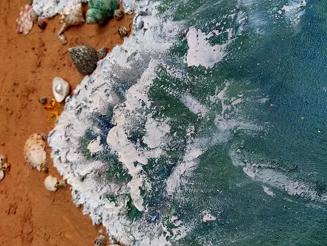 Fabi Ayyi Ala Islamic ocean wall art with Quranic calligraphy, textured blue waves, sandy shore and seashell details — full artwork view